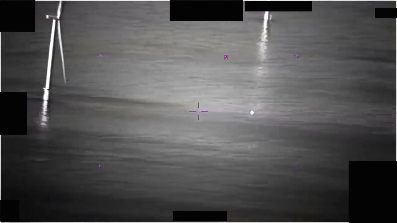 PR048 frame showing wind turbines and the tracked object over the Pacific at approximately 7:30
