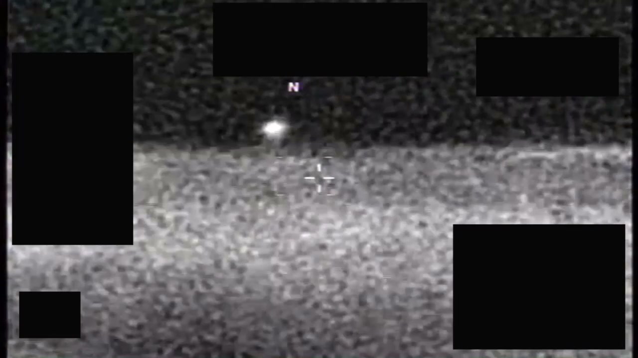 PR051 IR frame showing UAP tracked against scrolling cloud layer at approximately 1:00